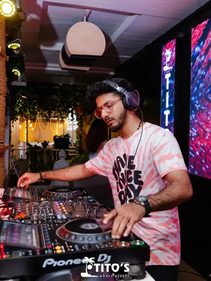 Mixing tracks at an outdoor section of Tito's. I can adapt my setup and music style for different environments, from indoor clubs to open-air venues.