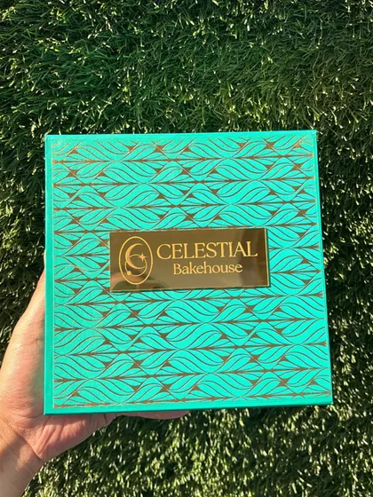 A close-up of our beautiful turquoise and gold festive box. We believe that a gift should be a joy to unwrap, and our packaging is designed with that in mind.