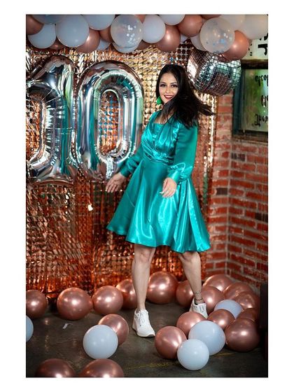 A dynamic shot from the same anniversary shoot, capturing a moment of joyful movement.