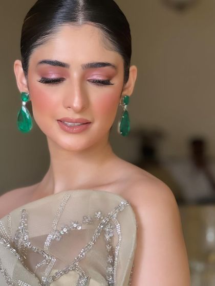 A close-up of the soft pink eyeshadow and flawless skin, a beautiful and versatile party look.