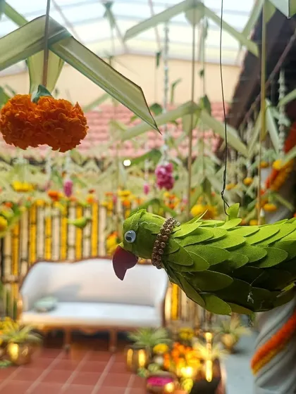 It's the small, handcrafted details that bring a traditional theme to life. For this event, I included these charming parrots made from leaves, adding a touch of nature and artistry to the South Indian decor.