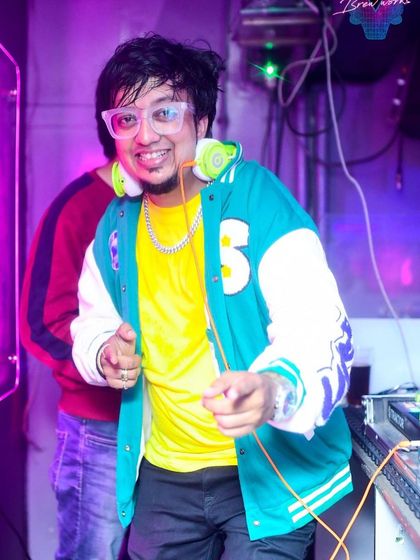 A shot of me pointing towards the crowd at Simon Says Brew Works, fully in my element. I love to connect with the audience while I am performing.