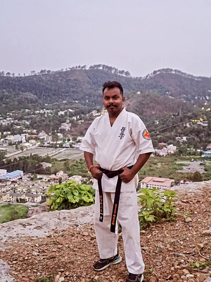 As a Sensei, I lead from the front. Here I am, taking a moment at the top of a hill overlooking the valley during our camp. The mountains provide the perfect backdrop for our martial arts journey.