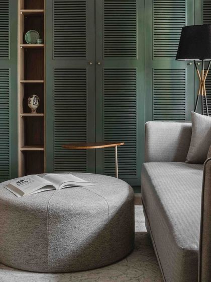 The home theater is designed for coziness. Soft fabrics, a plush rug, and warm lighting create the perfect environment for movie nights.