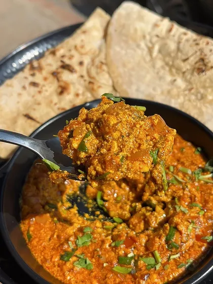 A spoonful of my Paneer Bhurji, showing the rich and creamy texture of the gravy.