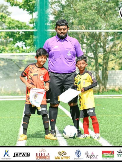 Sportsmanship is key. The captains of the two U9 finalist teams meet with the referee before the big match.