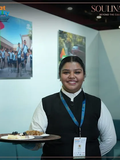 Our professional staff member serving guests at the Toyota pavilion during the Bharat Mobility Global Expo. We ensure warm and attentive hospitality at every event.