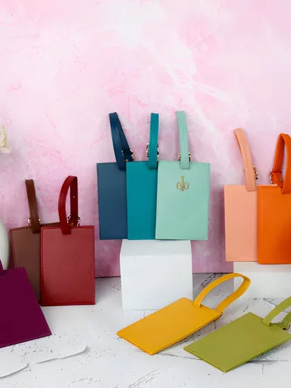 A colorful array of our personalized luggage tags, available in over 15 different shades to match any style or suitcase.