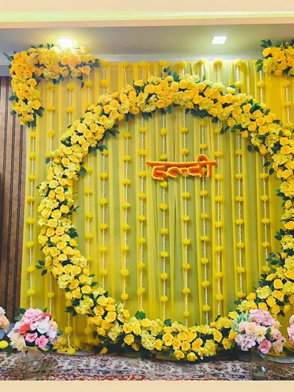 Soaking in the golden glow of a beautiful Haldi ceremony. We designed this stunning backdrop using a full circle of vibrant yellow marigolds and delicate draping to create a traditional yet fresh look for the bride-to-be.