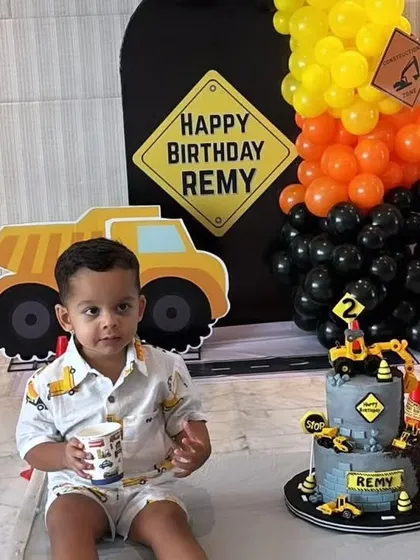 It was an honor to create this construction-themed cake for Radhika Gupta's son, Remy. The cake is designed to look like a construction site, complete with edible trucks, signs, and rubble, perfect for a little one who loves big machines.