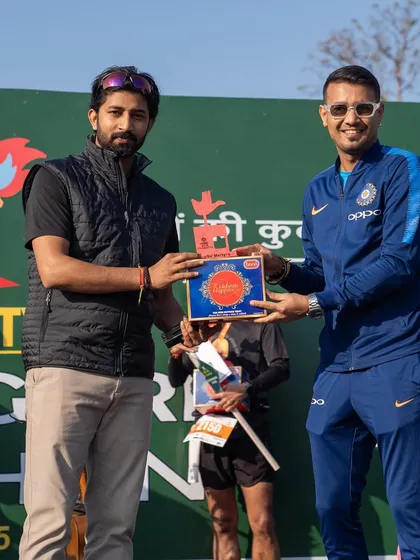 Presenting an award at the Chandigarh Marathon. My role often includes facilitating the awards ceremony and ensuring every winner is properly honored.