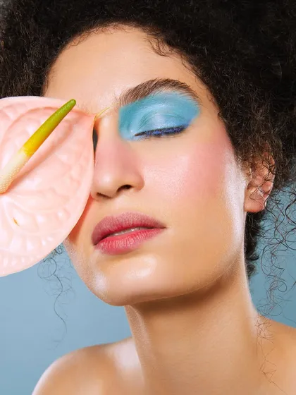 Another angle of the pastel blue look, creatively using a pink anthurium flower to complement the colors.