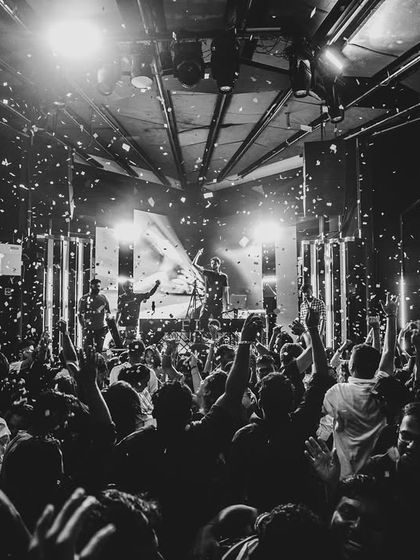 A black and white shot of the confetti blast over a packed dance floor. Pure chaos and joy.