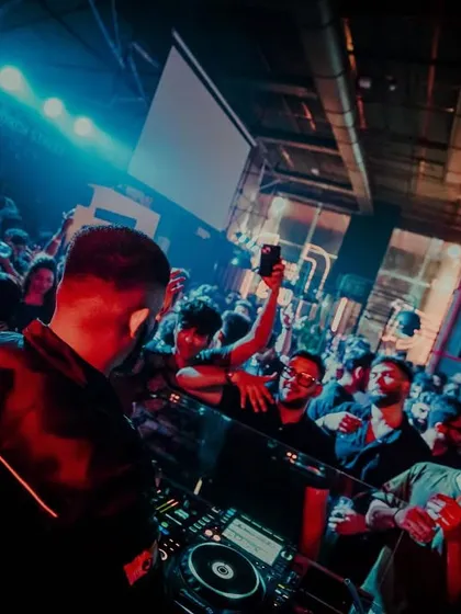 Another perspective from the NESCO Social gig, showing the crowd reaching out and fully engaged with the music.