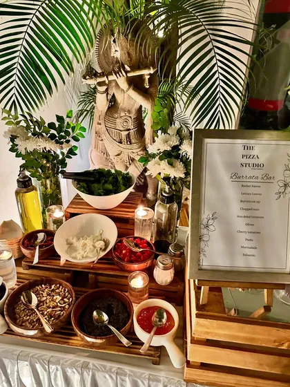 For a truly unique and elegant touch, we offer a specialized Burrata Bar. This setup features fresh burrata cheese accompanied by a variety of toppings like balsamic glaze, pesto, chopped tomatoes, and nuts, allowing guests to create their own gourmet salad.