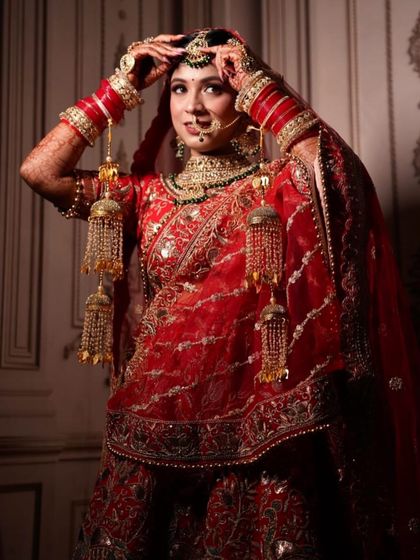 My pretty bride adjusting her maang tikka. These candid moments while getting ready are always so special.
