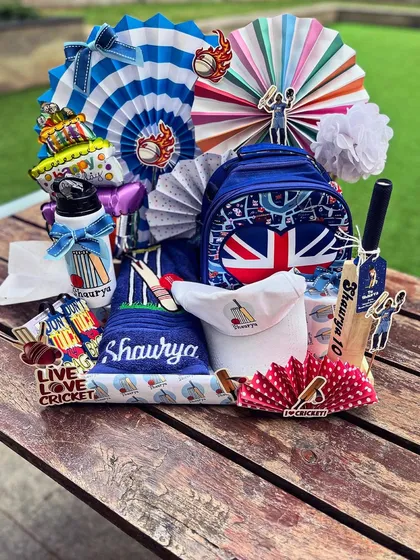 For a little champion's birthday, I created this cricket-themed world of joy. Every detail, from the personalized bat and cap to the sporty color palette, was curated to bring his childhood dream to life. I believe kids' gifts should be as imaginative as they are.