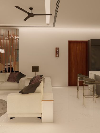 An open-plan layout where the living area flows into a kitchen with a breakfast bar. This design is perfect for casual dining and socializing, keeping the host connected with guests.