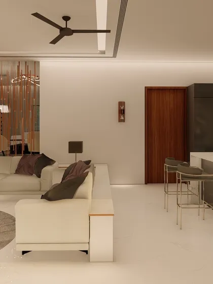 An open-plan layout where the living area flows into a kitchen with a breakfast bar. This design is perfect for casual dining and socializing, keeping the host connected with guests.