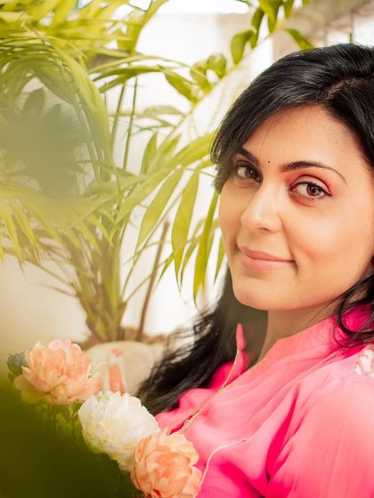 A soft and gentle portrait, with a subtle smile and warm lighting creating a welcoming feel.