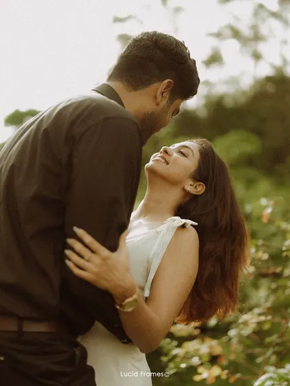An intimate embrace surrounded by nature. This close-up captures the pure affection and connection that is at the heart of our couple photography.