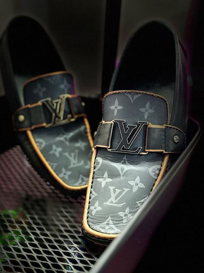 This was a restoration project on a pair of Louis Vuitton loafers. I carefully repainted them and added the monogram pattern back, making them look brand new.