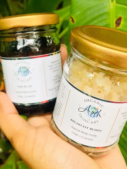 A peek at my natural body scrubs. On the left is the "FineByMe" coffee scrub, and on the right is the "Breakfast Buddy" with oatmeal. Both are made to gently exfoliate and nourish your skin.