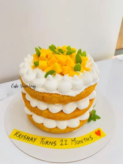 A naked mango cake celebrating 11 months of sweetness.