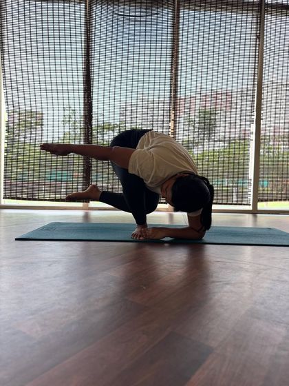 A clearer view of this challenging arm balance. It requires open hips, a strong core, and stable shoulders to hold the shape with integrity.