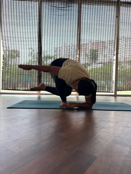 A clearer view of this challenging arm balance. It requires open hips, a strong core, and stable shoulders to hold the shape with integrity.