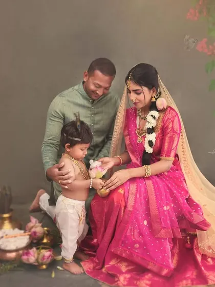 The whole family joins in to create this mythological narrative. Here, the father looks on as his little Krishna interacts with his mother, a beautiful moment of connection within our artistic setup.