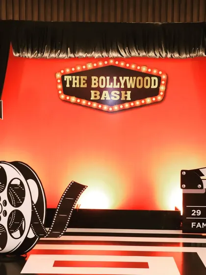 The main photo booth for the Bollywood-themed get-together for Fern Hotels & Resorts. The classic red backdrop and film-themed props were perfect for a night of corporate fun.