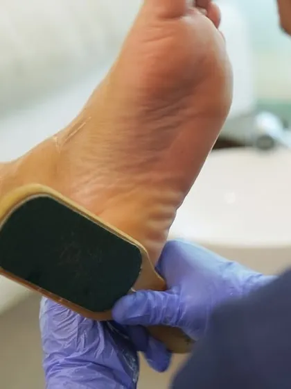 Smoothness starts here. We use a professional foot file to gently remove dry skin and calluses, revealing softer, healthier soles.