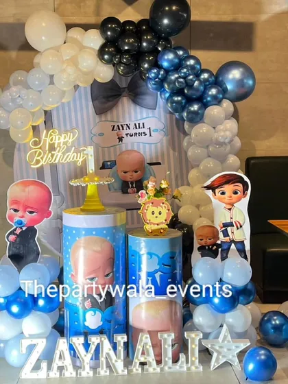 The same stylish Boss Baby setup, showing the full balloon arch and character cutouts. It's a modern and fun take on the popular theme.