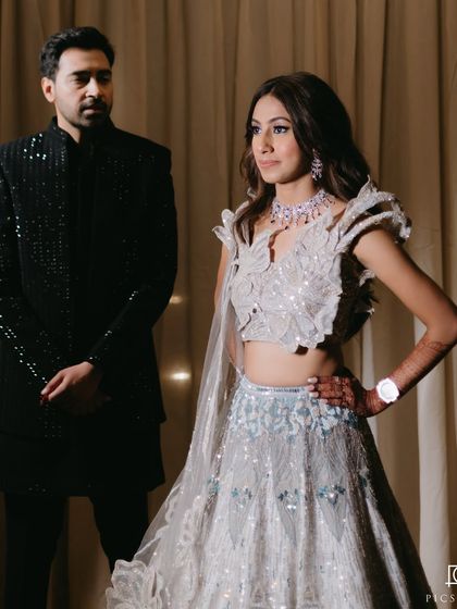 Another shot of the couple, showcasing their coordinated style.