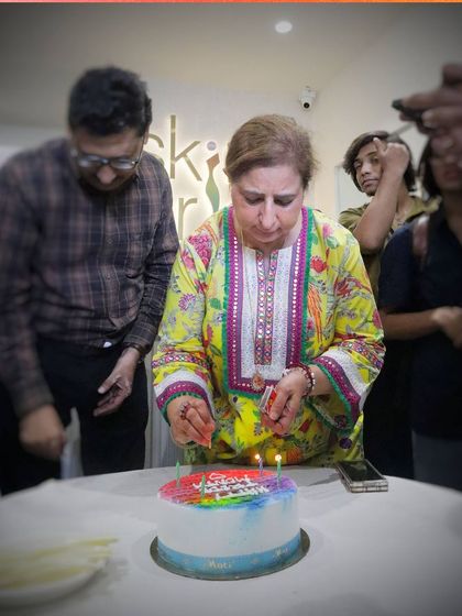 Our director, Deepika Mahajan, lighting the candles on the Pride cake. A moment of joy and celebration with our beloved community.