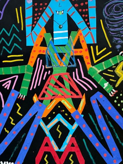 A student's name transformed into a vibrant, symmetrical monster. This project teaches the principles of symmetry and self-expression through letterforms.