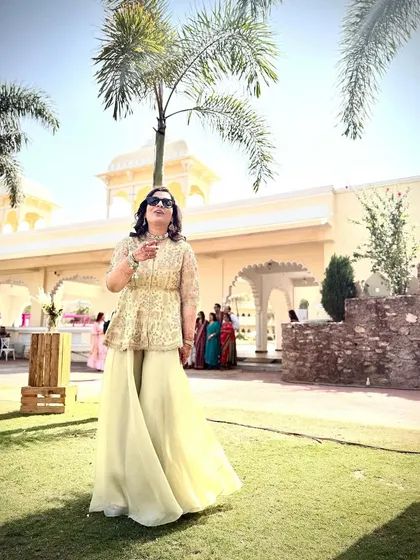 The sister of the groom deserves to shine too. For this Welcome Lunch, we chose a breezy yet beautifully embroidered peplum sharara set, ensuring she looked chic and felt comfortable throughout the celebration.