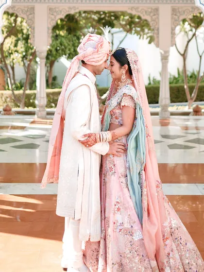 A portrait of a couple at The Leela Palace, Jaipur, where the setting is as much a part of the story as their love. The architecture provides a stunning canvas for creating elegant and timeless wedding photographs.