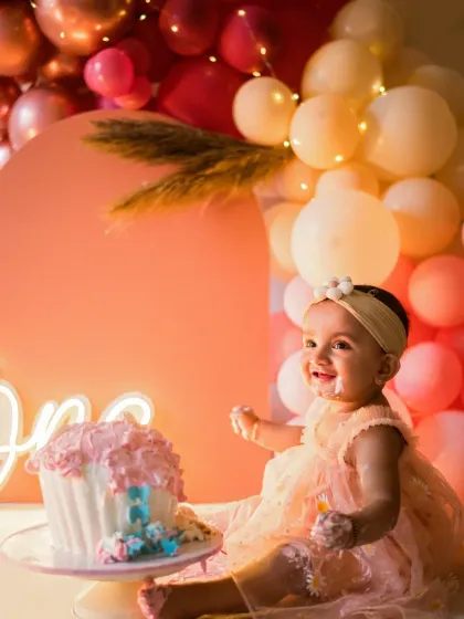 The pure delight of a first birthday cake smash! These sessions are all about fun, mess, and capturing your little one's personality as they celebrate a huge milestone. This baby's infectious giggle and frosting-covered smile say it all.