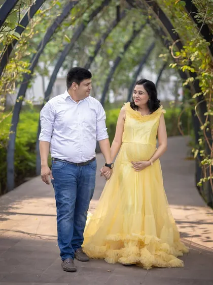 A simple walk in the park becomes a cherished memory. I capture candid moments like this, showing the happy journey you're on together.