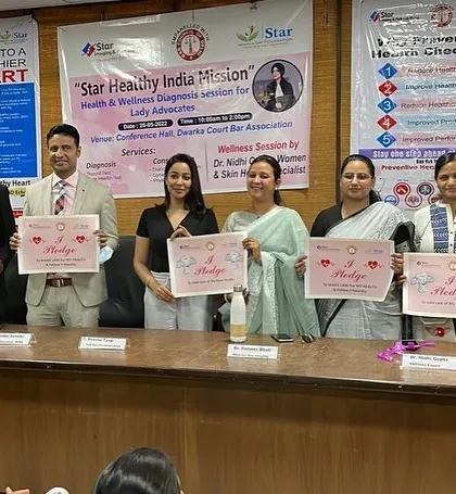 Taking a pledge for health and wellness with other professionals at the Dwarka Bar Association event. It's a collective effort.