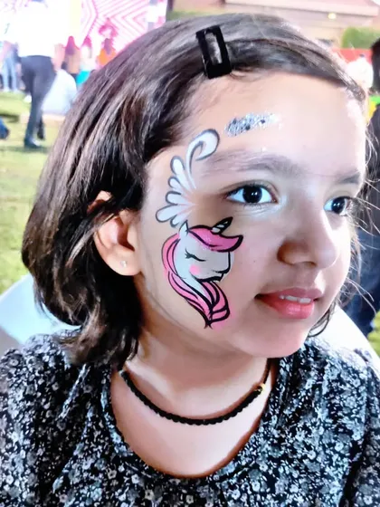A sweet unicorn design with white swirls and a touch of glitter, looking magical on this young girl.