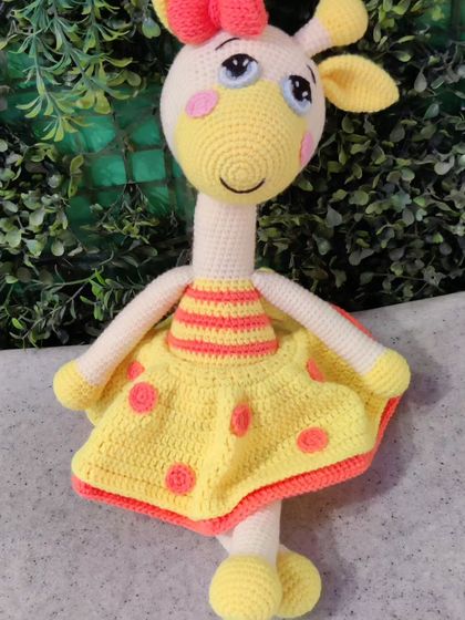 My 15-inch giraffe doll, customized with a cute yellow and orange polka-dot dress.