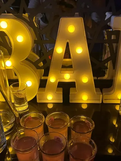 A close-up of our illuminated 'BAR' sign and some pre-poured shots, ready for the party to begin.