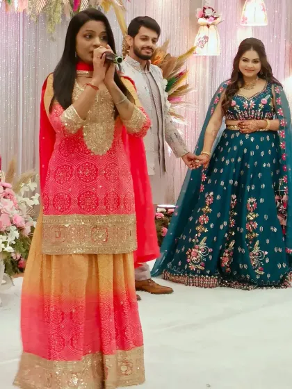 Guiding the couple on stage while my team of musicians sets a romantic mood.