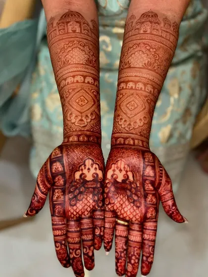 The fresh, vibrant stain of a bridal mehendi just after the paste has been removed. This initial orange color will deepen into a rich, dark brown over the next 48 hours.