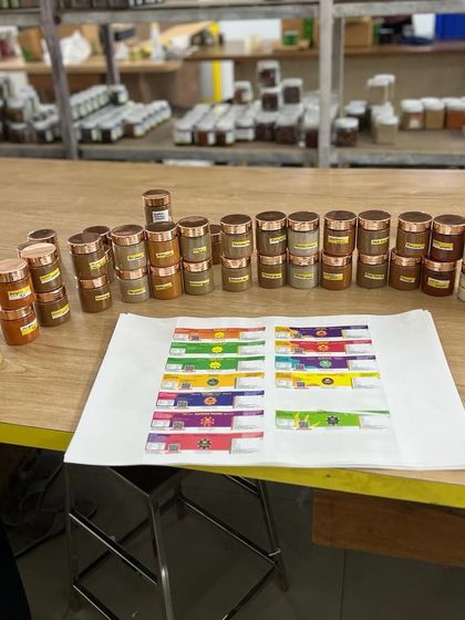 A behind-the-scenes look at our spice bar. Here you can see various masalas being prepared for labeling and packing, a snapshot of the daily hustle in our workshop.