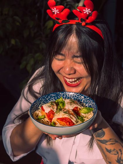 All smiles in Roxie town! A guest enjoys a festive pasta dish, getting a taste of the Christmas spirit.