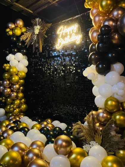 A close-up of the balloon arrangement and shimmer wall.